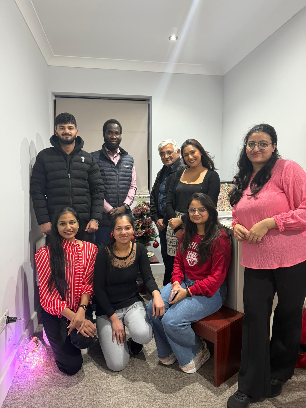Swan Care office team gathered together celebrating the festive season